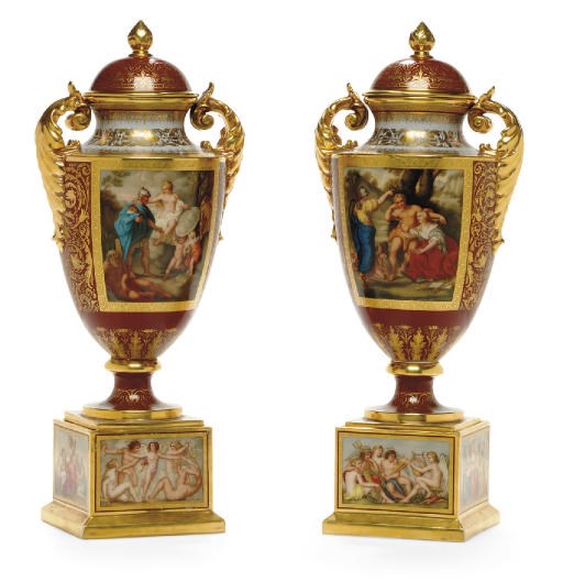 A PAIR OF VIENNA STYLE BURGUNDY-GROUND VASES AND COVERS ON SQUARE STANDS