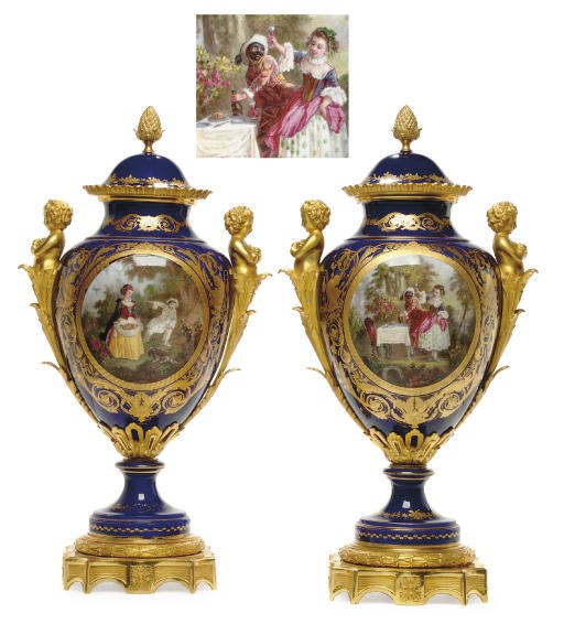 A PAIR OF ORMOLU-MOUNTED SÈVRES STYLE COBALT-BLUE GROUND VASES AND TWO COVERS