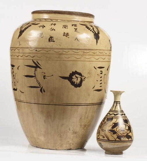 A large Chinese Cizhou cream-glazed jar and a Cizhou pear-shaped vase, Yuhuchun Ping