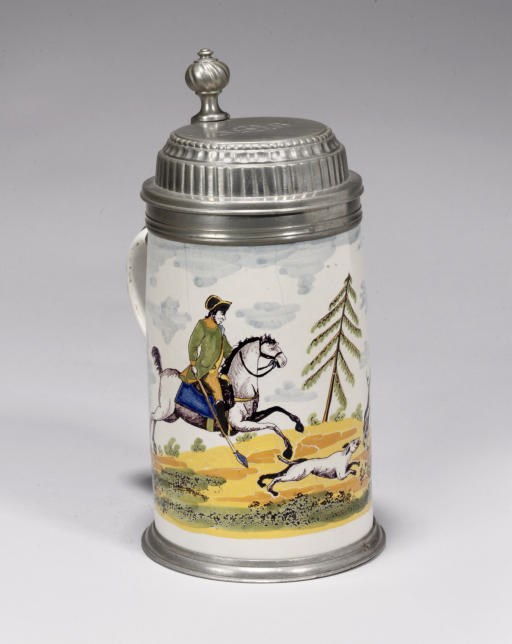 A GERMAN FAYENCE POLYCHROME PEWTER-MOUNTED TANKARD (JAGDKRUG)