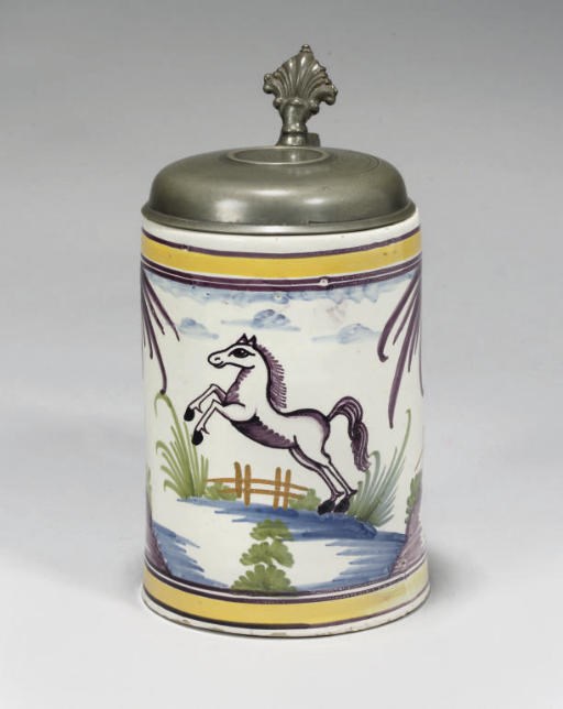 A GERMAN FAYENCE POLYCHROME PEWTER-MOUNTED CYLINDRICAL TANKARD (WALZENKRUG)