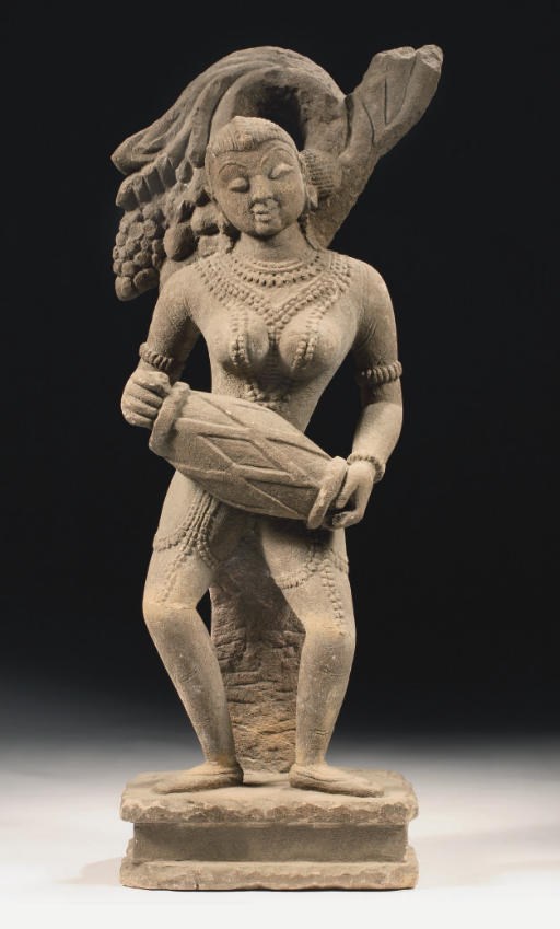 A Central Indian sandstone figure of a female drummer