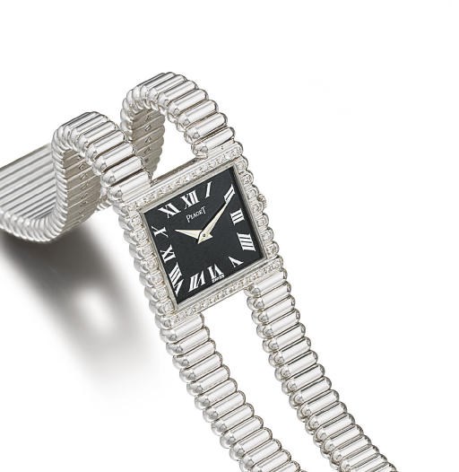 PIAGET. A FINE AND UNUSUAL 18K WHITE GOLD AND DIAMOND-SET WRISTWATCH WITH BRACELET