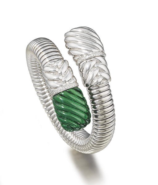ALEX BARTHELAY. A LADY'S 18K WHITE GOLD, DIAMOND-SET AND GREEN GLASS FLEXIBLE BANGLE WRISTWATCH WITH CONCEALED DIAL