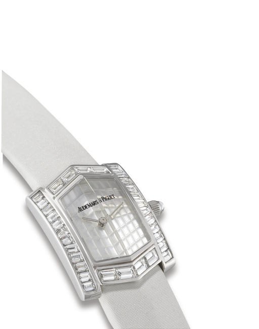 AUDEMARS PIGUET. A LADY'S 18K WHITE GOLD AND DIAMOND-SET LOZENGE-SHAPED WRISTWATCH
