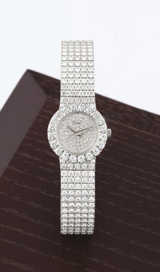 PIAGET. A LADY'S 18K WHITE GOLD AND DIAMOND-SET WRISTWATCH WITH BRACELET