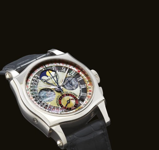 ROGER DUBUIS. A FINE AND RARE LIMITED PRODUCTION 18K WHITE GOLD BI-RETROGRADE PERPETUAL CALENDAR CHRONOGRAPH WRISTWATCH WITH PHASES OF THE MOON AND MOTHER-OF-PEARL DIAL