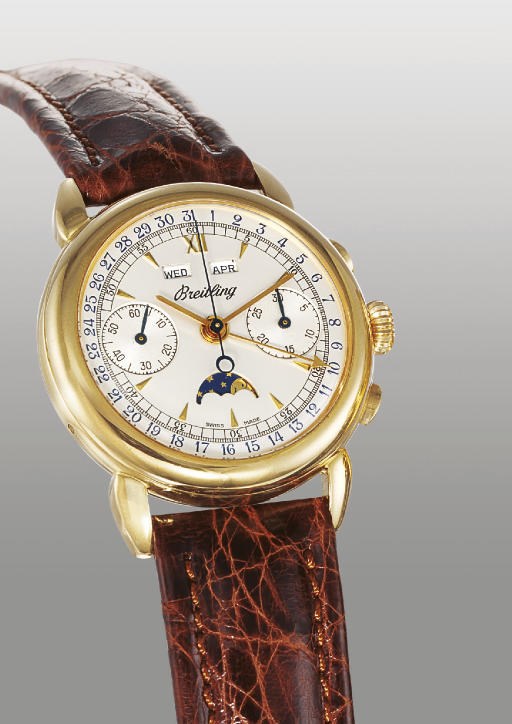 BREITLING. AN 18K GOLD TRIPLE CALENDAR CHRONOGRAPH WRISTWATCH WITH PHASES OF THE MOON