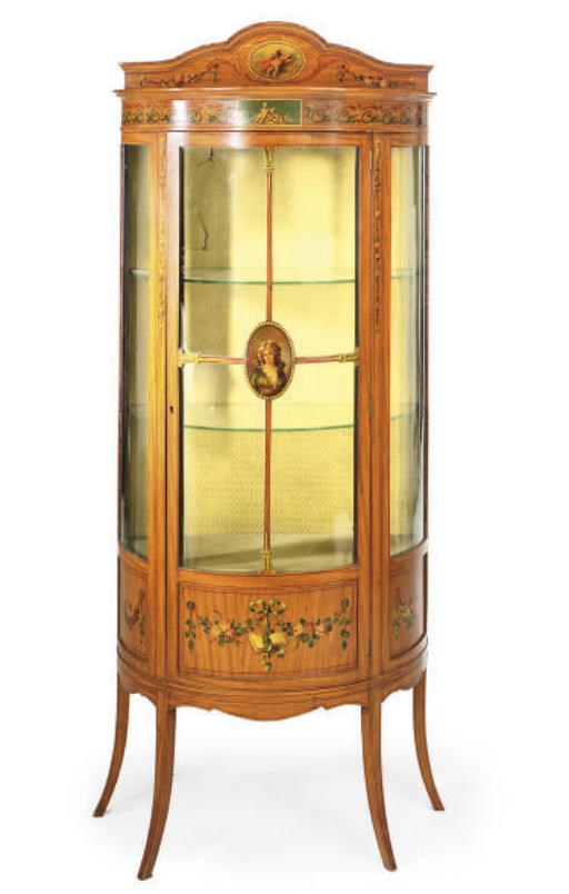 AN EDWARDIAN SATINWOOD AND POLYCHROME DECORATED BOWFRONT VITRINE