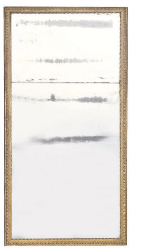 A FRENCH GILT COMPOSITION MIRROR