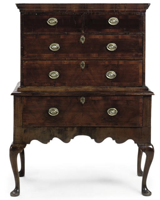 A GEORGE I WALNUT CHEST ON STAND