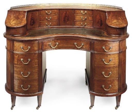 AN EDWARDIAN MAHOGANY KIDNEY SHAPED CARLTON HOUSE DESK