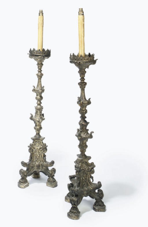 A PAIR OF ITALIAN SILVERED GESSO AND CARVED WOOD ALTAR CANDLESTICKS