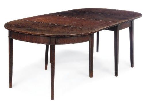 A GEORGE III MAHOGANY DINING TABLE