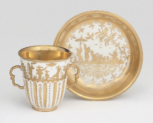 A MEISSEN GOLDCHINESEN TWO-HANDLED BEAKER AND SAUCER
