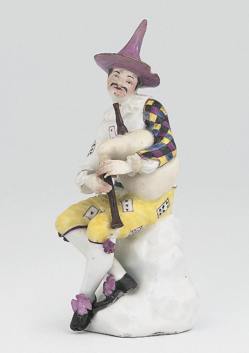 A MEISSEN FIGURE OF HARLEQUIN