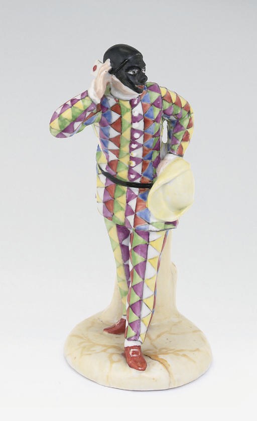 A KLOSTER VEILSDORF FIGURE OF HARLEQUIN