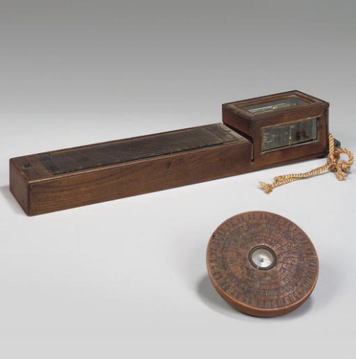 A Japanese wood and brass pillar clock, 19th Century