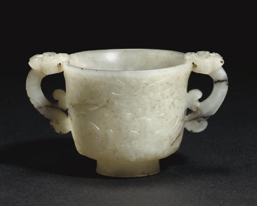 A Chinese white and russet jade two-handled cup, 18th century