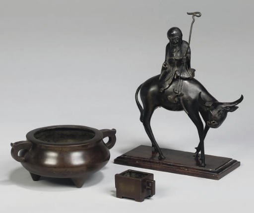 A Chinese bronze censer of Shoulou on an ox