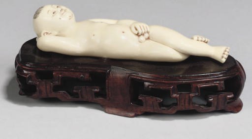 A Chinese ivory doctors model of a boy, 20th Century