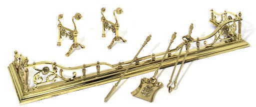 A LATE VICTORIAN BRASS FENDER SET