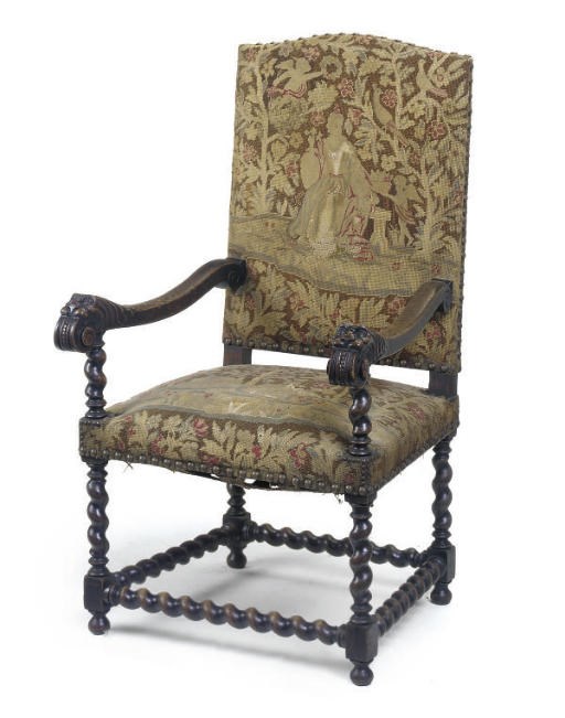A VICTORIAN OAK ARMCHAIR