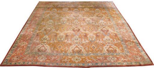 A unusual large English carpet of Cucasian Dragon design