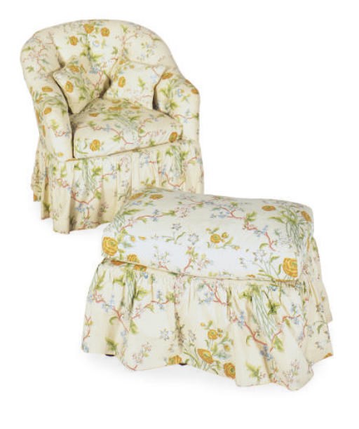 AN UPHOLSTERED LOUNGE CHAIR AND OTTOMAN,