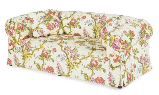 A CREAM AND POLYCHROME FLORAL UPHOLSTERED SOFA,