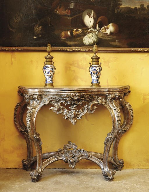 A SOUTH ITALIAN SILVER-GILT SERPENTINE CONSOLE TABLE