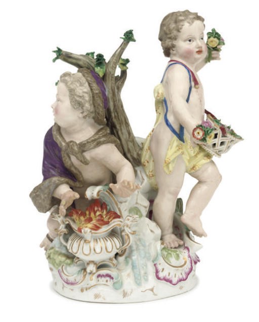 A MEISSEN GROUP OF TWO PUTTI EMBLEMATIC OF SPRING AND WINTER