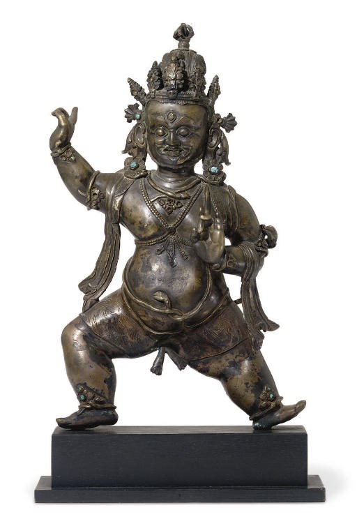 A bronze figure of a protector deity
