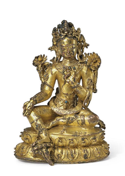 A small gilt bronze figure of Tara