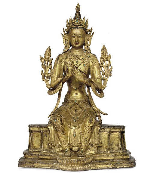 A gilt bronze figure of Maitreya