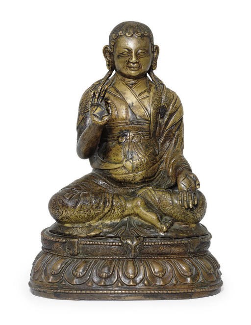 A bronze figure of a lama