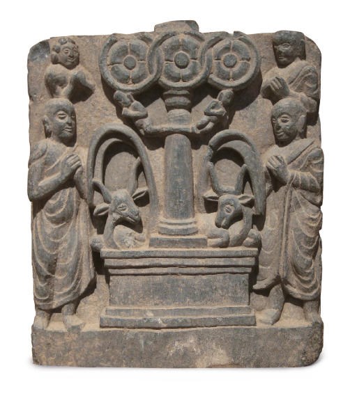 A rare gray schist frieze of the Buddha's First Sermon