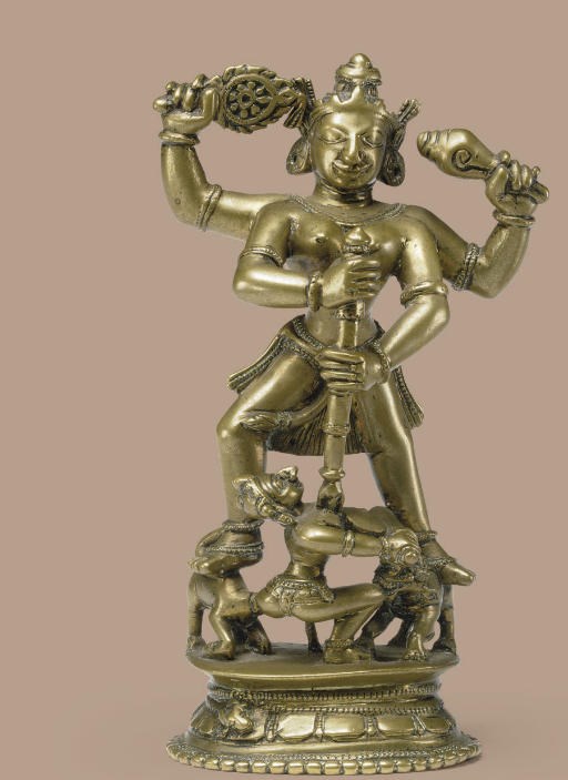 A brass figure of Durga slaying the buffalo