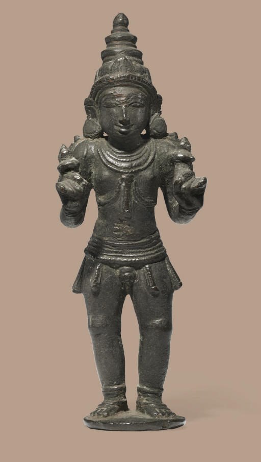 A bronze figure of a Skanda