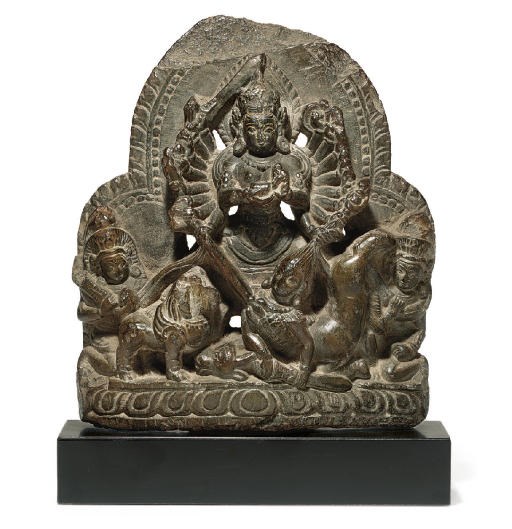 A gray stone figure of Durga