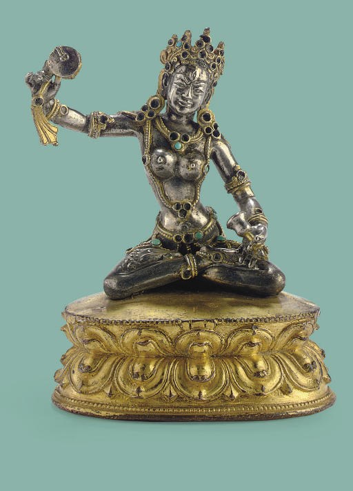 A silver and gilt copper figure of Macig