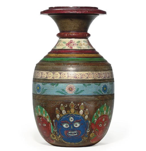 A painted wooden water pot with Heads of Mother Goddesses