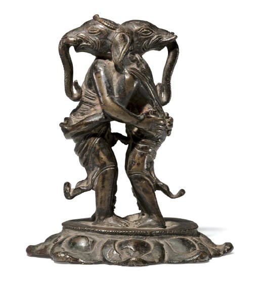 A rare bronze figure of embracing Ganeshas