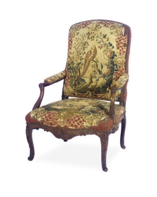 A REGENCE WALNUT AND BEECHWOOD FAUTEUIL,