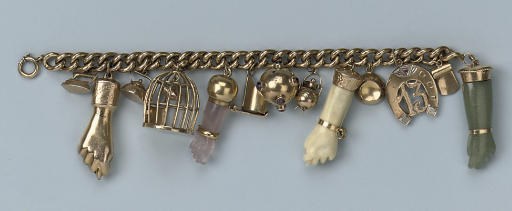 A GOLD CHARM BRACELET
