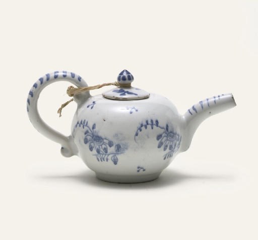 A KLOSTER-VEILSDORF FAYENCE MINIATURE BLUE AND WHITE TEAPOT AND COVER