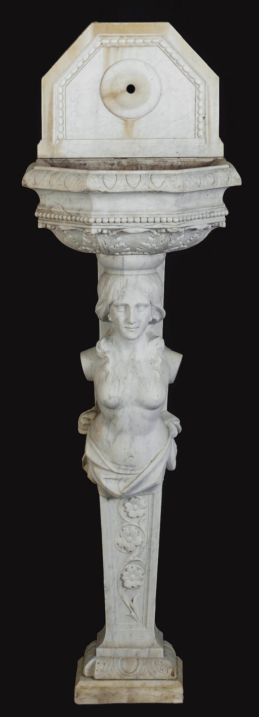 A CARVED MARBLE FIGURAL WALL FOUNTAIN