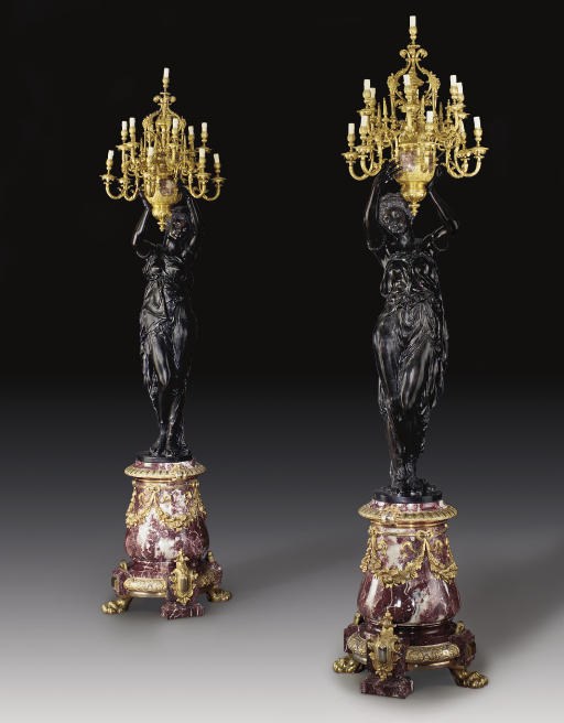 A PAIR OF MONUMENTAL ORMOLU, PATINATED BRONZE AND MARBLE TWELVE-LIGHT FIGURAL TORCHERES