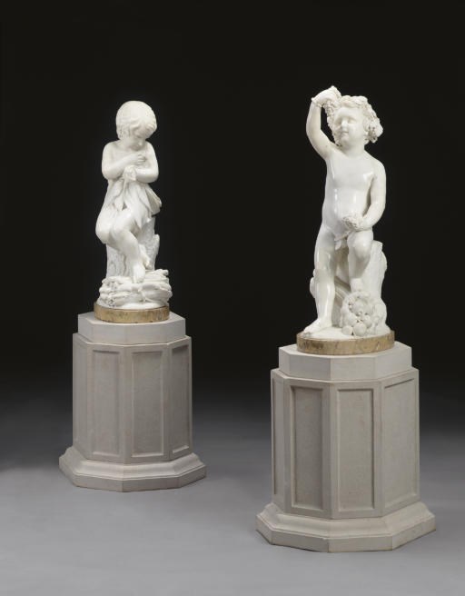A PAIR OF ITALIAN MARBLE FIGURES OF PUTTI EMBLEMATIC OF AUTUMN AND WINTER