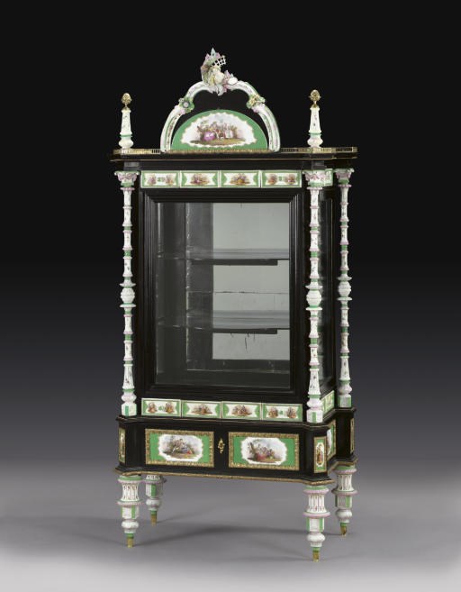 A GERMAN GILT-METAL AND MEISSEN PORCELAIN-MOUNTED EBONISED VITRINE